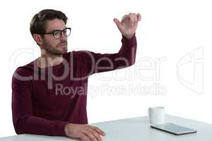 Man pretending to use an invisible screen