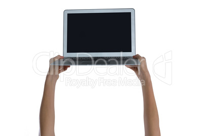 Womans hand holding laptop