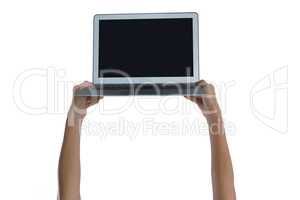 Womans hand holding laptop