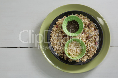 Muesli and cereal in plate on white background