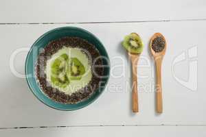 Breakfast and sliced kiwi in spoon
