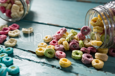 Cereal rings spilling out of bottle