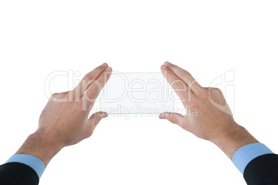 Cropped hands of businessman using interface Cropped hands of businessman using interface