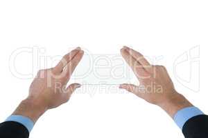 Cropped hands of businessman using interface