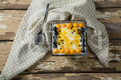 Yogurt with blueberries and golden berries in bowl