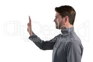 Man gesturing stop sign against white background
