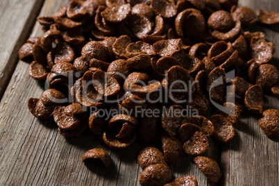 Chocolate corn flakes on wooden table