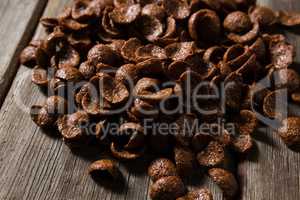 Chocolate corn flakes on wooden table