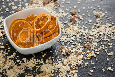 Bowl of dried orange slices and breakfast cereals