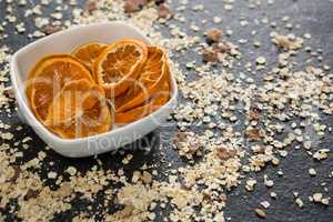 Bowl of dried orange slices and breakfast cereals