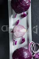 Overhead view of onion with red cabbages in plate
