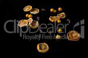 Sweet lemon and cape gooseberry on black background