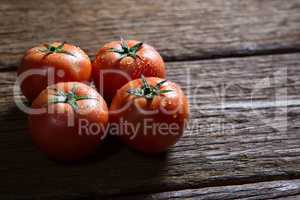Fresh tomatoes on wooden table