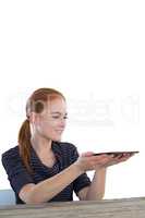 Happy young businesswoman holding digital tablet