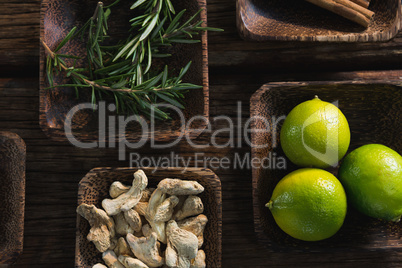 Dried ginger, lime and rosemary herb in a bowl