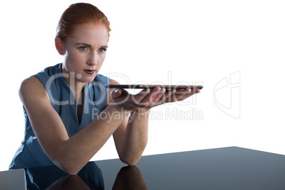 Young businesswoman holding digital tablet