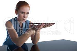 Young businesswoman holding digital tablet