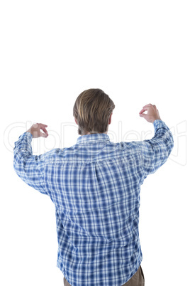 Rear view of businessman promoting imaginary product during presentation