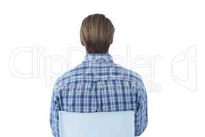 Rear view of businessman sitting on gray chair