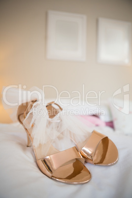 Bride sandals on bed