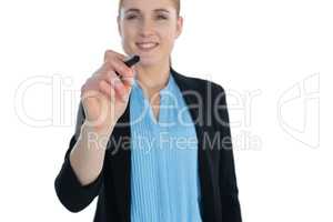 Smiling businesswoman with on imaginary interface