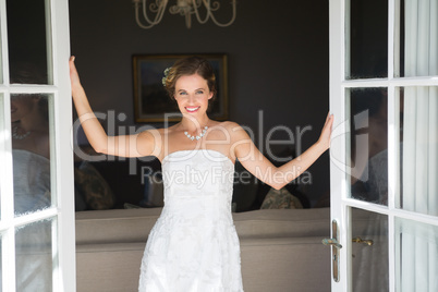 Beautiful bride standing at doorway