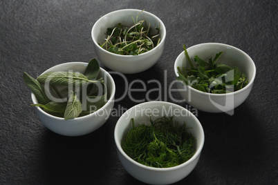 Various herbs in bowls