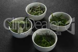 Various herbs in bowls