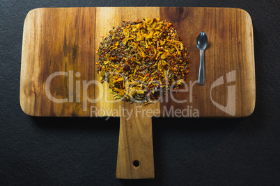 Mix spices with spoon wooden board