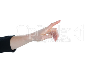 Cropped hand of businesswoman using imaginary interface