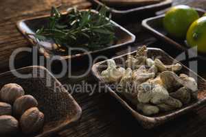 Dried ginger, nutmeg and rosemary herb in a bowl