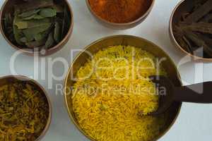 Various spices in bowl on white background