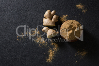 Bowl of ginger powder with ginger