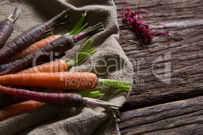 Fresh carrots on napkin