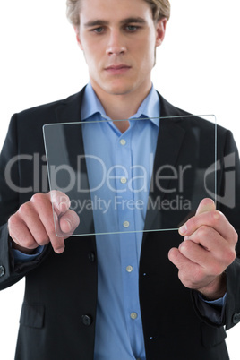 Serious businessman using transparent glass interface