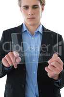 Serious businessman using transparent glass interface