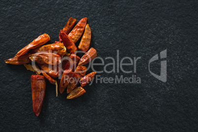 Dried red chili pepper on black background