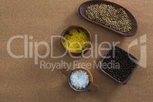 Coriander seeds, rice, black pepper seed and salt in bowl