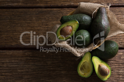 Avocados on wooden table