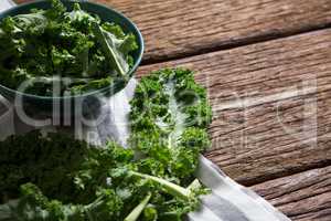 Mustard greens on wooden table