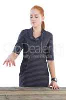 Young businesswoman holding invisible product