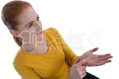 High angle view of businesswoman gesturing on imaginary product
