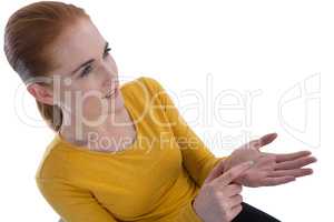 High angle view of businesswoman gesturing on imaginary product