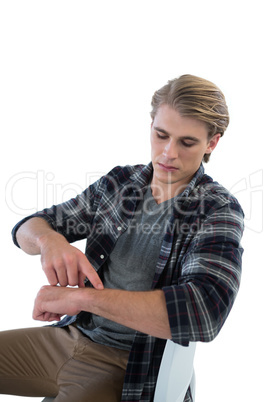 Young businessman pointing on imaginary wristwatch