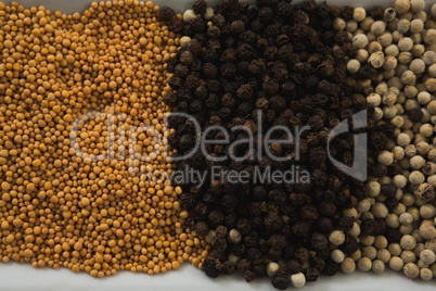 Various spices and seeds in tray