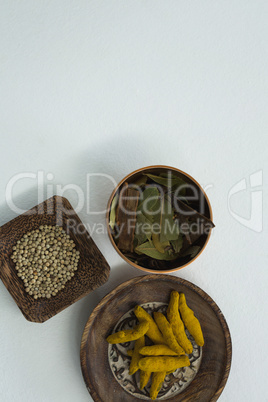 Turmeric raw seed, bay leaf and seed in bowl