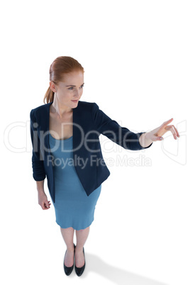 Full length of businesswoman using imaginary interface