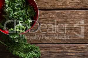 Mustard greens on wooden table