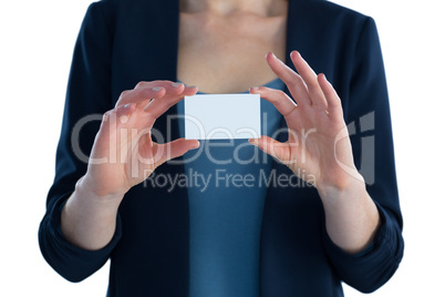 Mid section of businesswoman holding white card