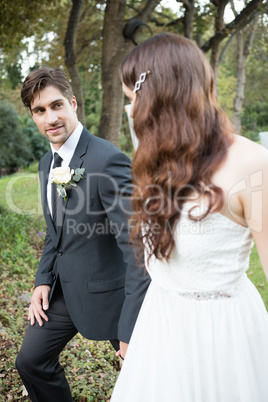 Couple looking at each other while walking in park